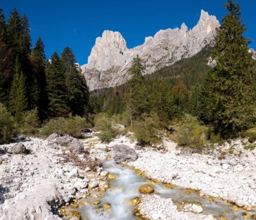 Mountain stream flowing through Val Pradidali