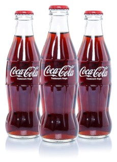 Coca Cola Coca-Cola lemonade soft drink drinks in bottles cut-out isolated against a white background