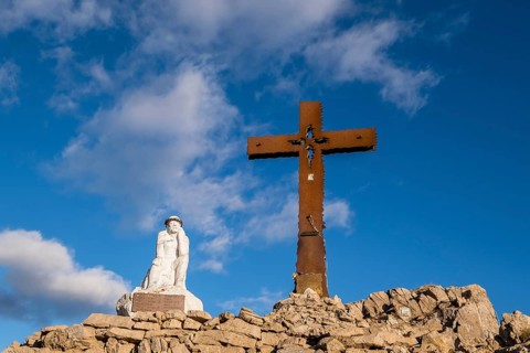 Summit cross and Jesus figure on Monte Castellaz