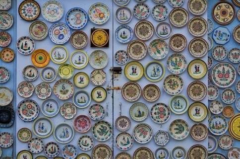 Hand-painted collection plates decorate house wall