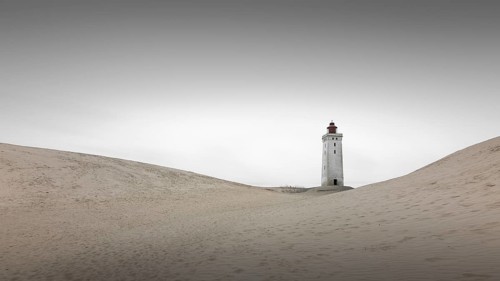Lighthouse in the Rubjerg Knude shifting sand dune