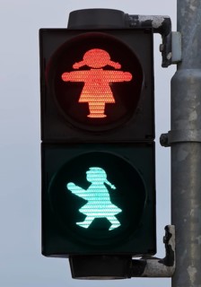 Pedestrian traffic light with red and green traffic light woman