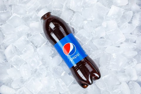 Pepsi Cola in plastic bottle lemonade soft drink drink on ice cube ice cubes