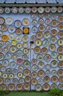 Hand-painted collection plates decorate house wall