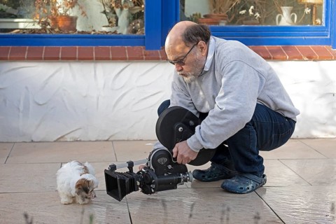 Animal photographer films Bolonka Zwetna puppy with 16mm camera