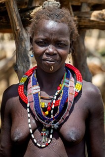 Friendly traditional dressed girl from the Toposa tribe