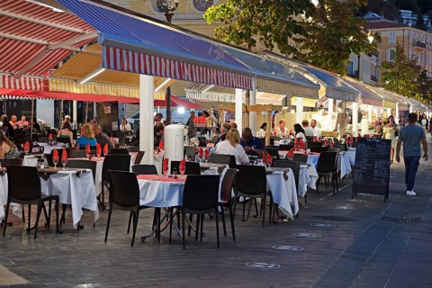 Evening hustle and bustle with restaurants and market stalls on the Cours Saleya