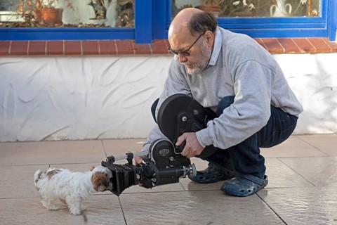 Animal photographer films Bolonka Zwetna puppy with 16mm camera