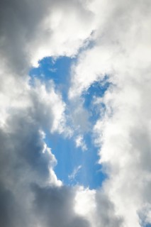 Stratocumulus clouds and blue sky windows form spectacular cloud formation in the sky during Foehn storm
