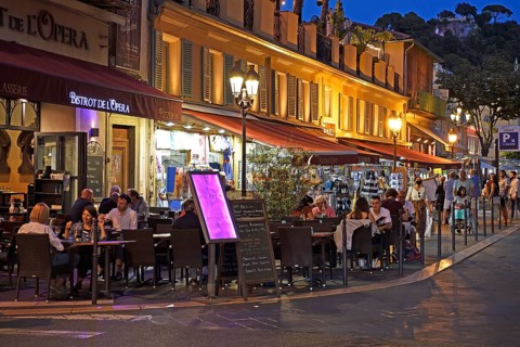 Evening hustle and bustle with restaurants and market stalls on the Cours Saleya