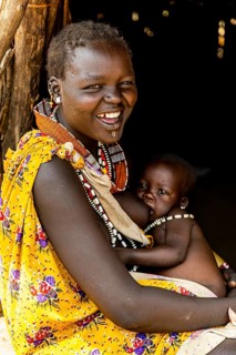 Woman from the Toposa tribe breastfeeding her baby