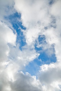 Stratocumulus clouds and blue sky windows form spectacular cloud formation in the sky during Foehn storm