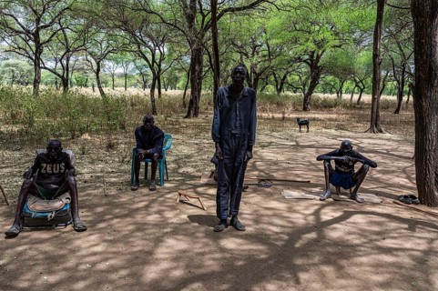 Olders of the Toposa tribe have a reunion under the trees