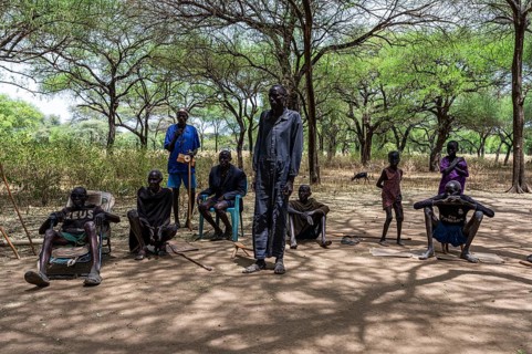 Olders of the Toposa tribe have a reunion under the trees