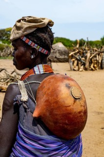Woman with a gourd on her back from the Toposa tribe