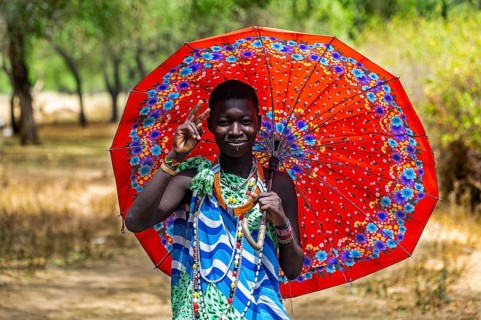 Girl carrying an umbrella