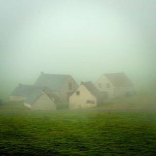 Houses of the faithrail of Brion in the mist in autum