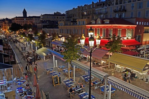 Evening hustle and bustle with restaurants and market stalls on the Cours Saleya
