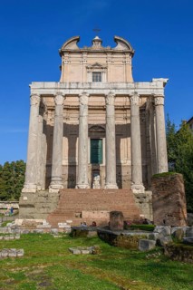 Historic facade of Temple of Pius and Faustina with staircase and ancient columns