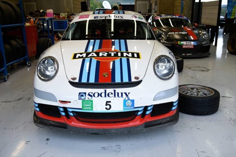 Porsche 911 GT3 in pitbox during tyre change to rain tyres on trackday