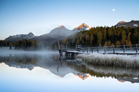 Mountain peaks reflected in Lake Staz
