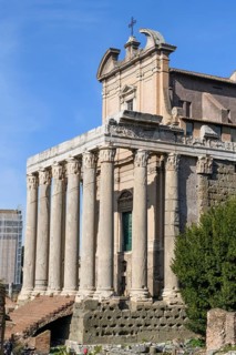 Historic facade of Temple of Pius and Faustina with staircase and ancient columns