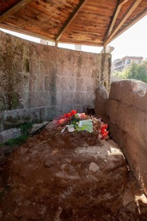 Cremation site of Gaius Julius Caesar with floral decoration at foot of Temple of Divine Divus Iulius