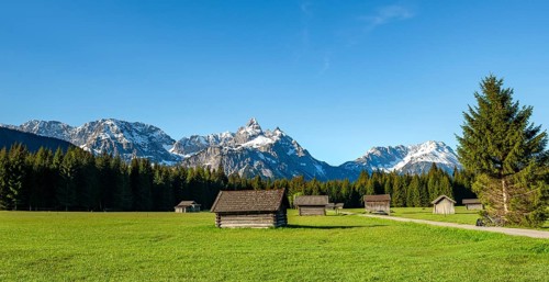 Meadow with hay barns
