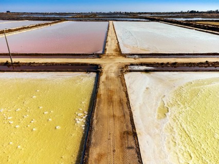 Amazing colors of sea salt ponds called salines shortly before salt extraction in Portugal