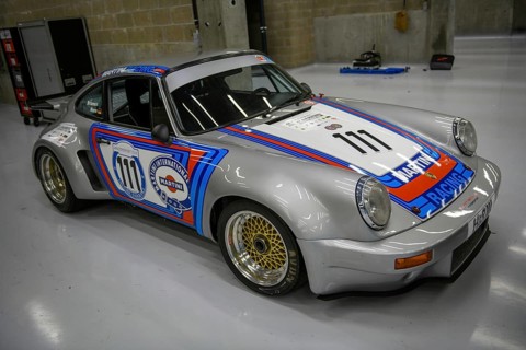 Historic race car Porsche 911 RSR from 1974 in the pits of Circuit de Spa-Francorchamps