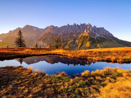 Mandlwaende and Hochkoenig at sunset reflected in a mountain lake