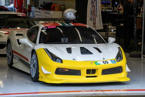 Ferrari 488 Challenge stands in pit box in pit lane