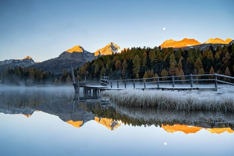 Mountain peaks reflected in Lake Staz