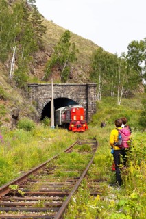 Hikers and a railway on the old route of the Trans-Siberian Railway