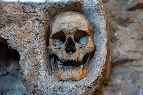 Stone structure embedded with human skulls