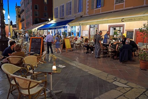 Evening hustle and bustle with restaurants and market stalls on the Cours Saleya