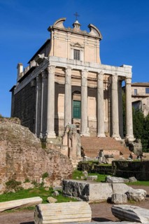 Historic facade of Temple of Pius and Faustina with staircase and ancient columns