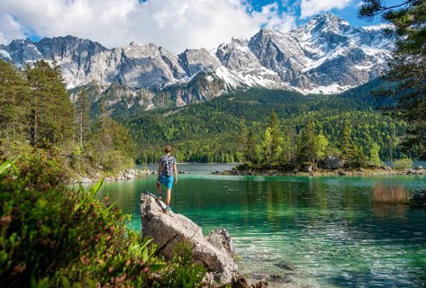 Young man standing on a rock