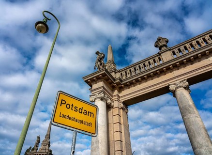 The colonnades with the Potsdam city entrance sign at the Glienicke Bridge