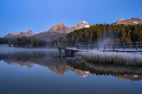 Mountain peaks reflected in Lake Staz