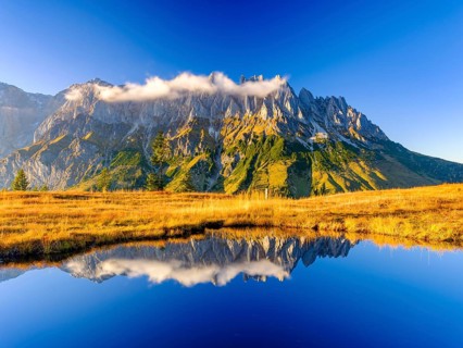 Mandlwaende reflected in a mountain lake