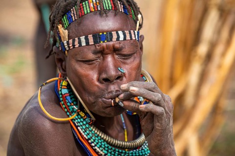 Traditional dressed women smoking