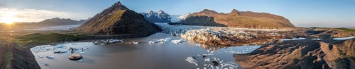 Glacial river in front of Mountains with Hvannadalshnukur