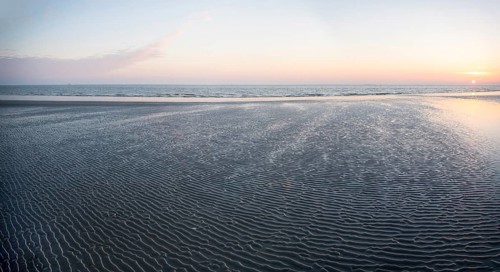 Panorama romantic sunrise in the Wadden Sea