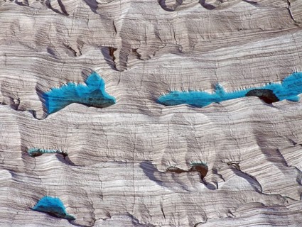Blue meltwater lakes on a glacier