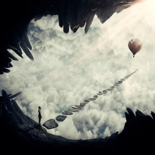 Boy in a abstract place above the clouds