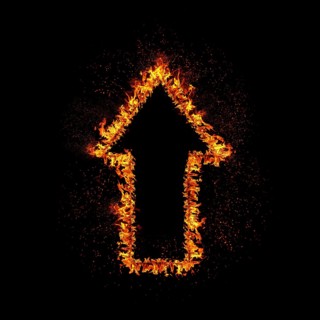 Flaming arrow grow up isolated on black background
