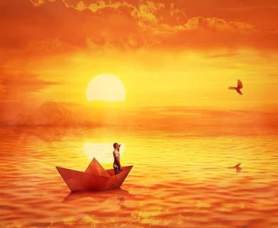 Silhouette of a lonely boy in a paper boat sailing lost in the ocean