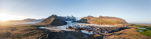 Glacial river in front of Mountains with Hvannadalshnukur