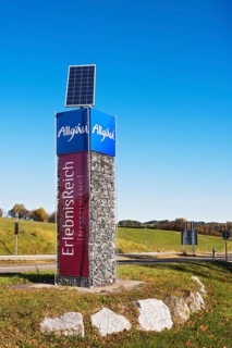 Column with advertising for Allgaeu and Nesselwang with solar panel